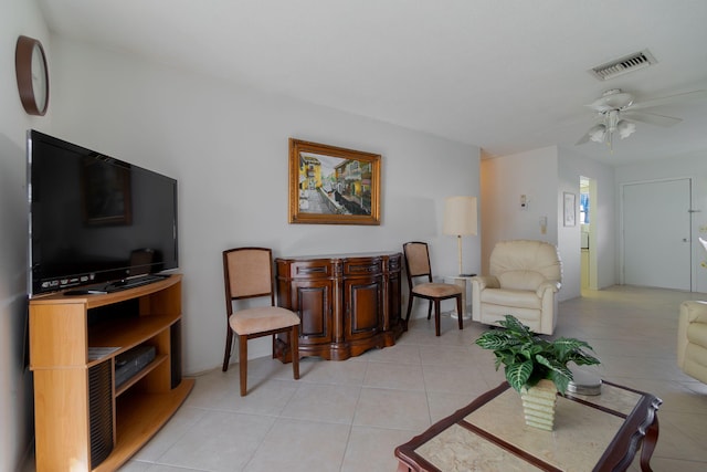 living room with ceiling fan and light tile patterned floors