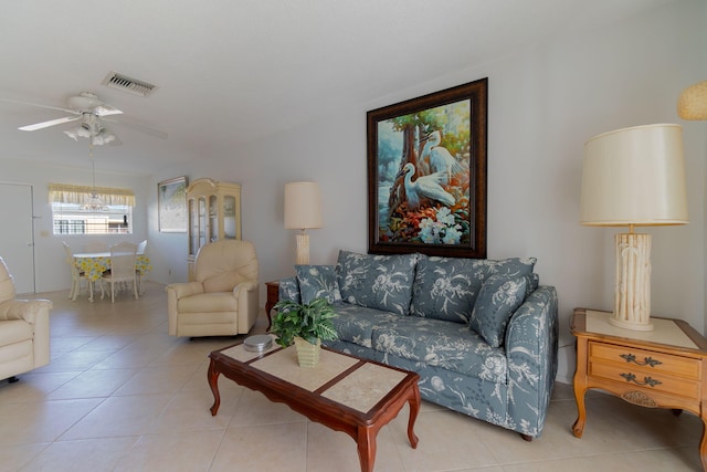 tiled living room featuring ceiling fan