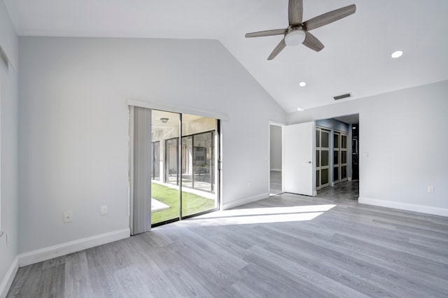 unfurnished room featuring high vaulted ceiling, light hardwood / wood-style flooring, and ceiling fan