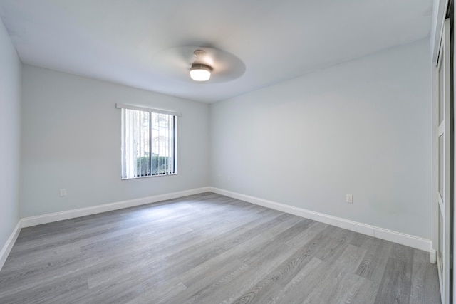 empty room with wood-type flooring