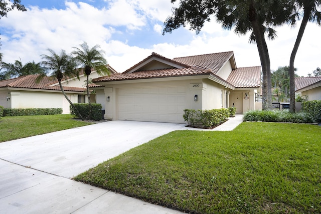 view of front of house featuring a front yard and a garage