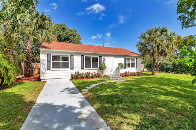 6312 Garden Ave, West Palm Beach, FL 33405 - ranch-style home featuring a shingled roof