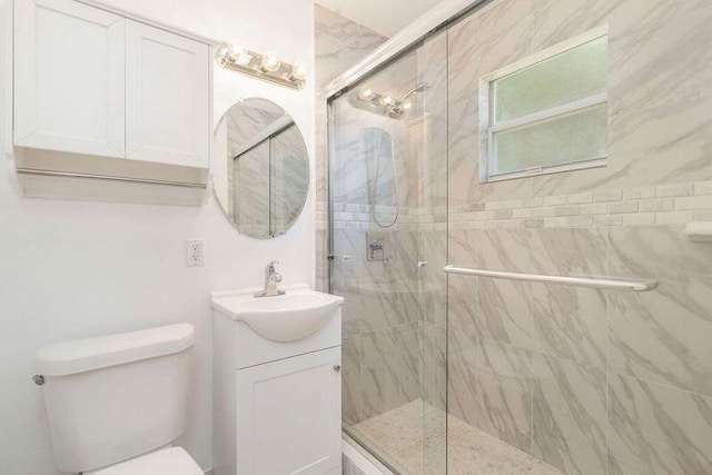 6312 Garden Ave, West Palm Beach, FL 33405 - full bath with a marble finish shower, toilet, and vanity