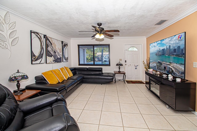 living room featuring crown molding, light tile patterned floors, and a textured ceiling