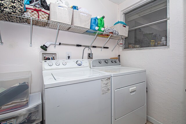 laundry room with washer and dryer