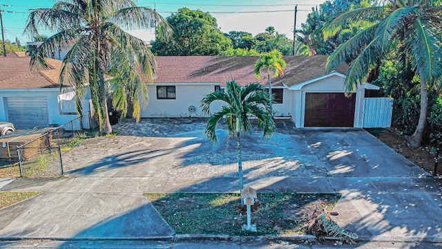 single story home featuring a garage