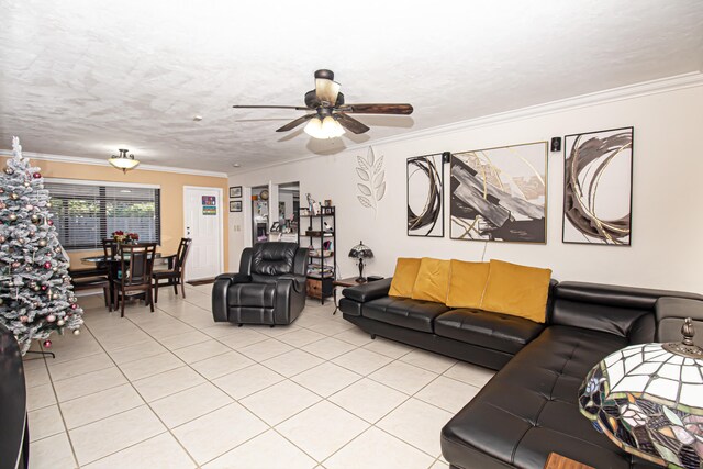 living room featuring a textured ceiling, ceiling fan, light tile patterned floors, and crown molding