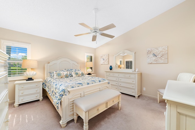 bedroom with carpet floors, vaulted ceiling, and ceiling fan