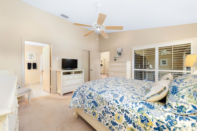 carpeted bedroom featuring ensuite bath, ceiling fan, and high vaulted ceiling