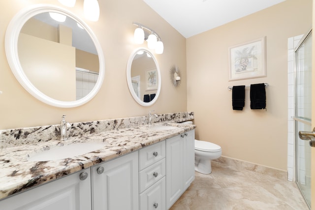 bathroom with vanity, toilet, and lofted ceiling