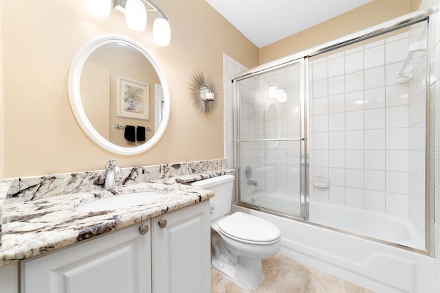 full bathroom featuring tile patterned flooring, vanity, enclosed tub / shower combo, and toilet