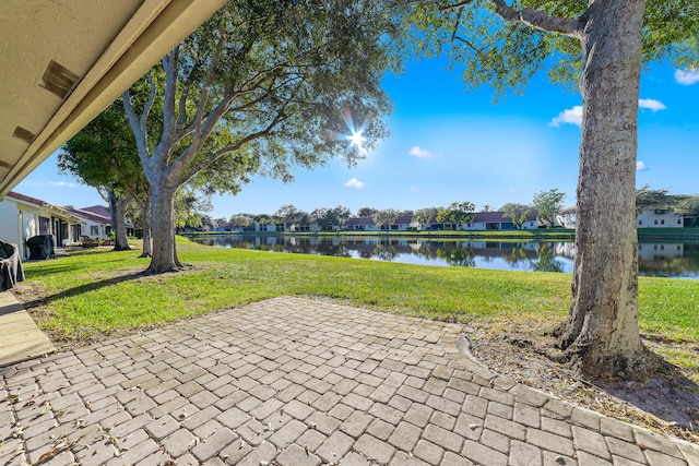 view of patio featuring a water view