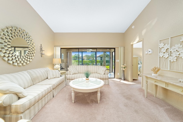 living room featuring carpet floors and vaulted ceiling