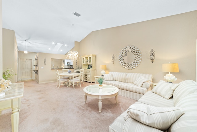 carpeted living room with vaulted ceiling