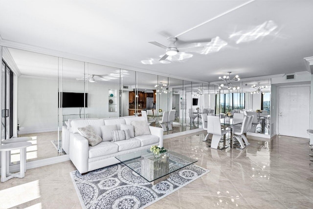 living room featuring ceiling fan with notable chandelier and ornamental molding