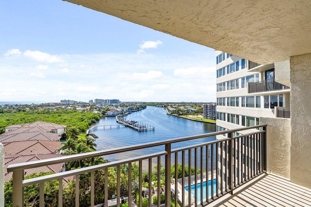 balcony featuring a water view