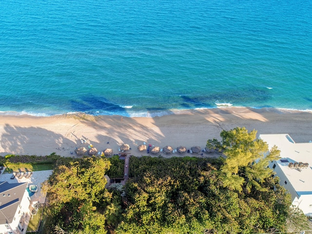 drone / aerial view featuring a view of the beach and a water view