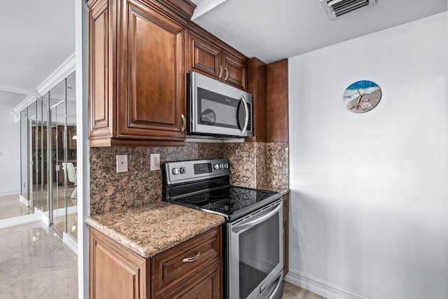 kitchen with decorative backsplash, stainless steel appliances, and stone counters