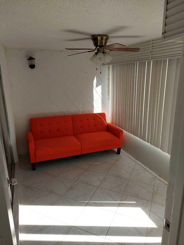 tiled living room with a textured ceiling