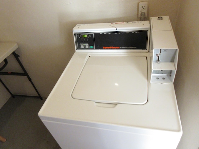 clothes washing area featuring washer / dryer