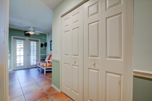 interior space featuring french doors and light tile patterned flooring