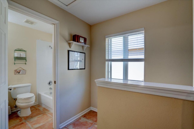 bathroom with tile patterned flooring,  shower combination, and toilet