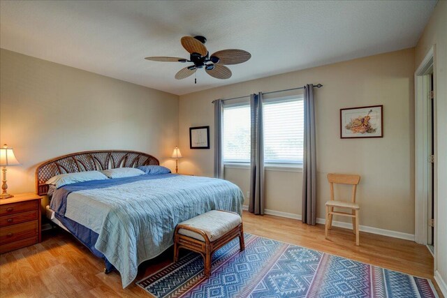 bedroom featuring ceiling fan and hardwood / wood-style floors