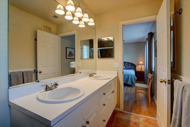 bathroom featuring tile patterned floors and vanity