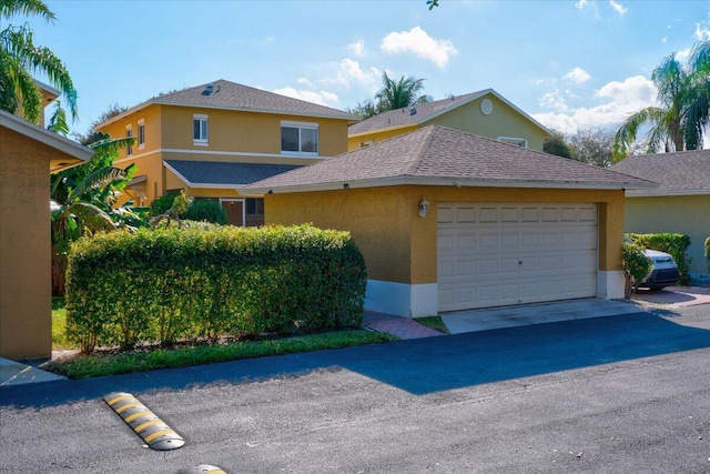 front of property with a garage