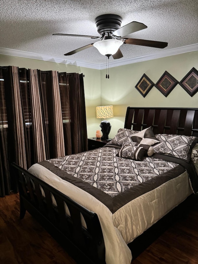 bedroom featuring ceiling fan, dark hardwood / wood-style flooring, and crown molding