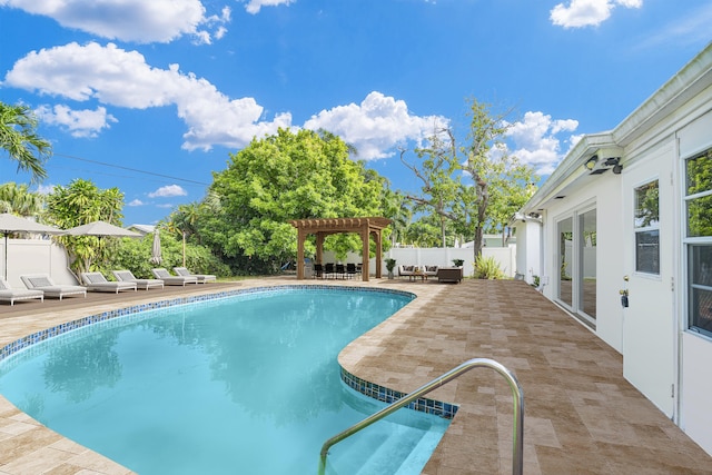 view of pool with a pergola and a patio area