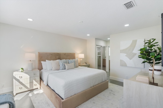 bedroom with recessed lighting, a closet, visible vents, and baseboards