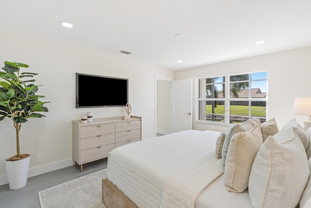 bedroom with recessed lighting, visible vents, and baseboards