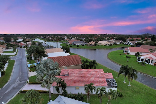 bird's eye view with a water view and a residential view