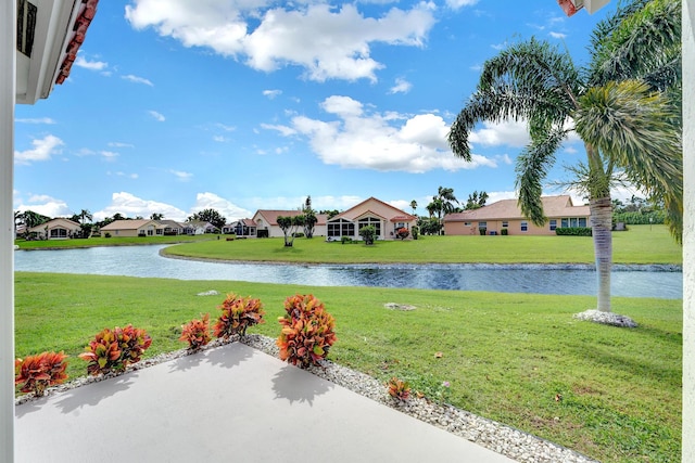 view of yard with a patio and a water view