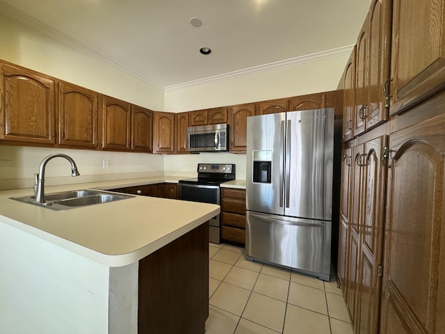 kitchen with sink, light tile patterned floors, ornamental molding, appliances with stainless steel finishes, and kitchen peninsula