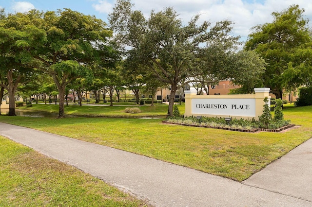 view of home's community with a yard