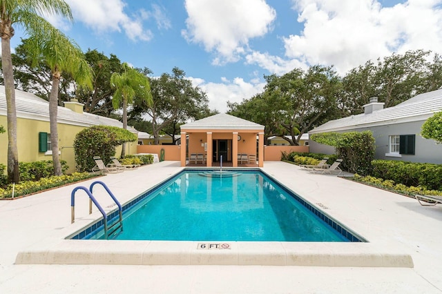 view of swimming pool with a patio area