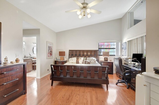 bedroom featuring ceiling fan, vaulted ceiling, and light wood-type flooring