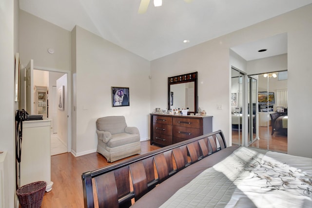 bedroom featuring ceiling fan, a closet, ensuite bathroom, and light hardwood / wood-style flooring