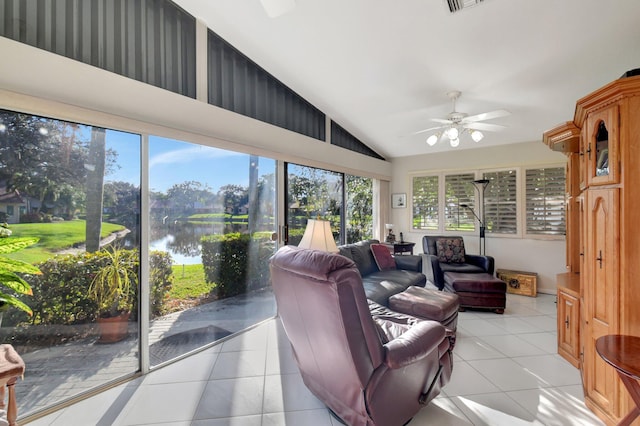 sunroom featuring ceiling fan, a healthy amount of sunlight, a water view, and vaulted ceiling