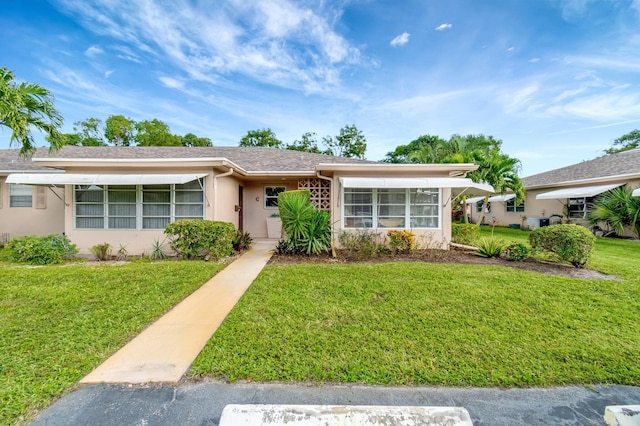 ranch-style house with a front yard