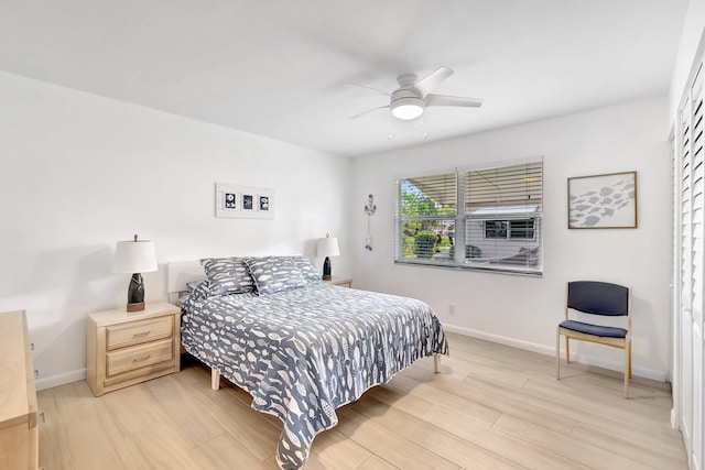 bedroom featuring ceiling fan and light hardwood / wood-style floors