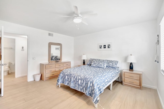 bedroom featuring connected bathroom, light hardwood / wood-style floors, and ceiling fan