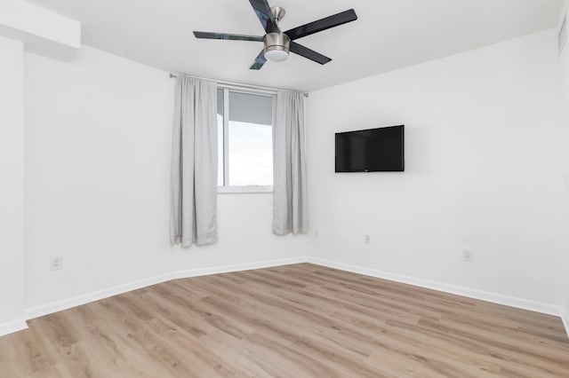 unfurnished room featuring ceiling fan and light hardwood / wood-style floors