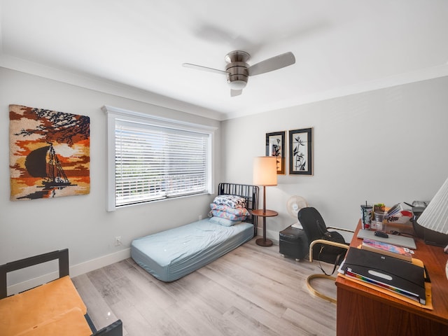 bedroom with ceiling fan, light hardwood / wood-style flooring, and crown molding