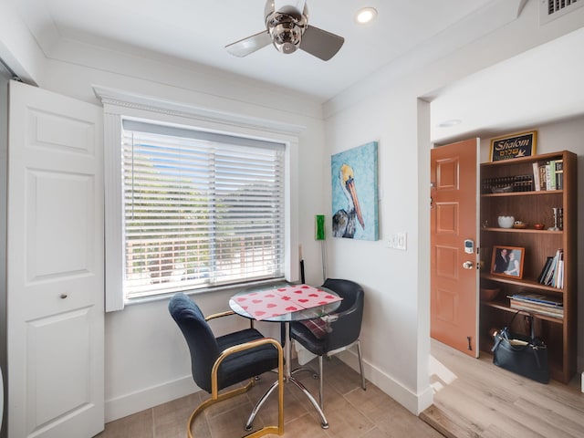 dining space featuring ceiling fan and light hardwood / wood-style flooring