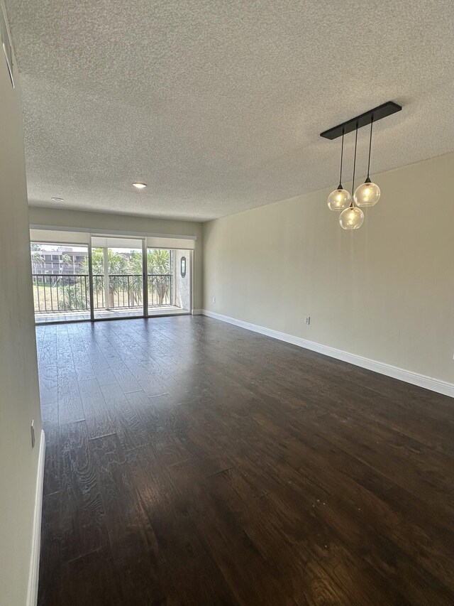 living room featuring hardwood / wood-style flooring and a textured ceiling