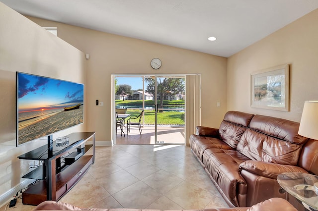 living room with light tile patterned floors and lofted ceiling