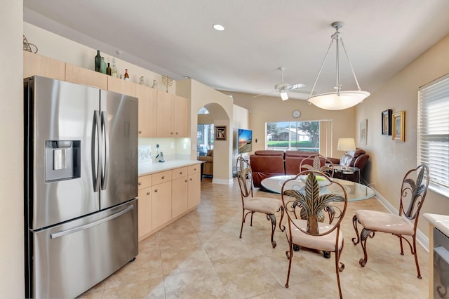 dining area with ceiling fan, light tile patterned flooring, and a healthy amount of sunlight